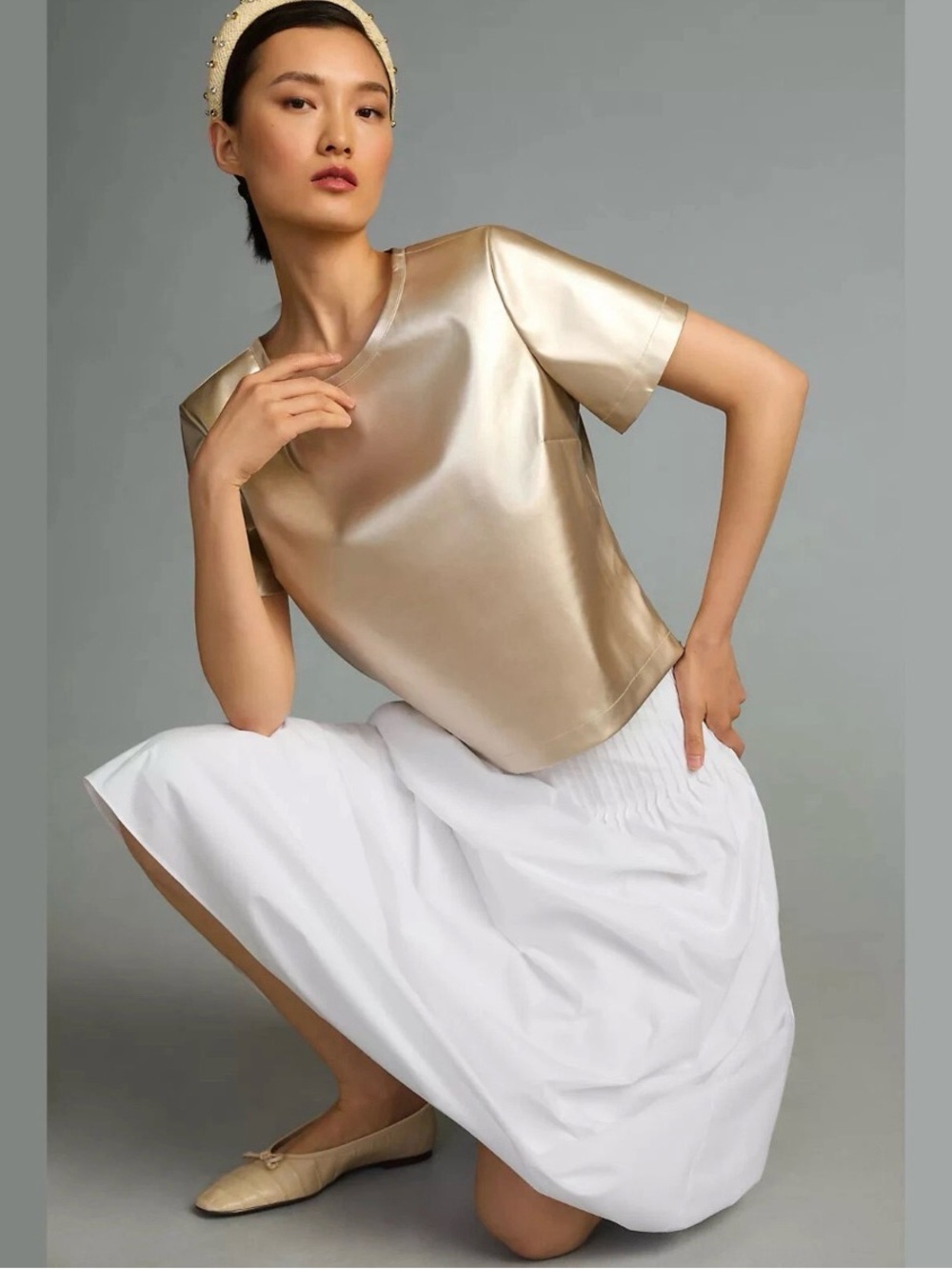 Anthropologie faux leather porridge gold blouse.